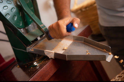 Hand using a nut crusher
