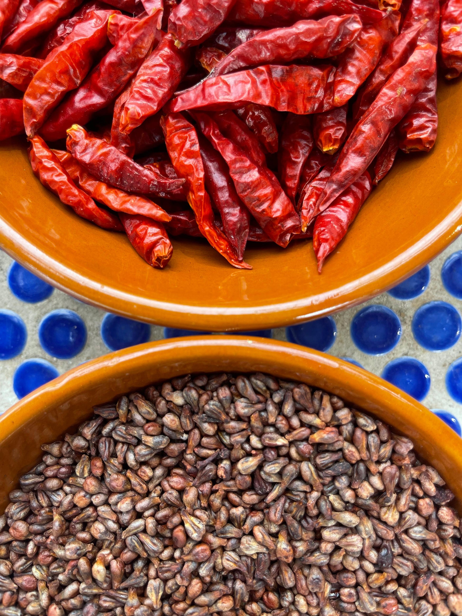 Chili and grapeseed ready to be cold-pressed