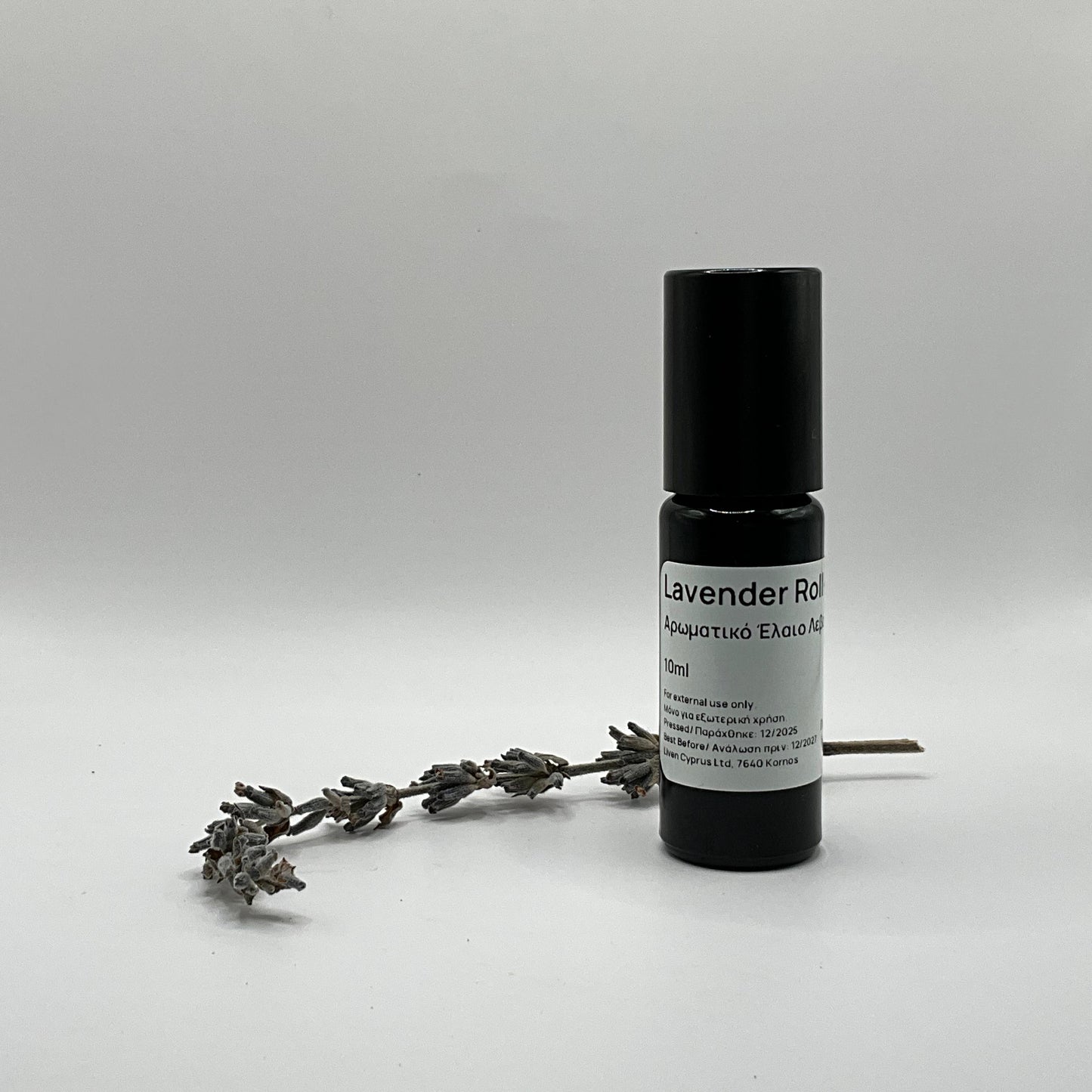 Roll-on bottle labeled 'Lavender Roll' with a sprig of lavender