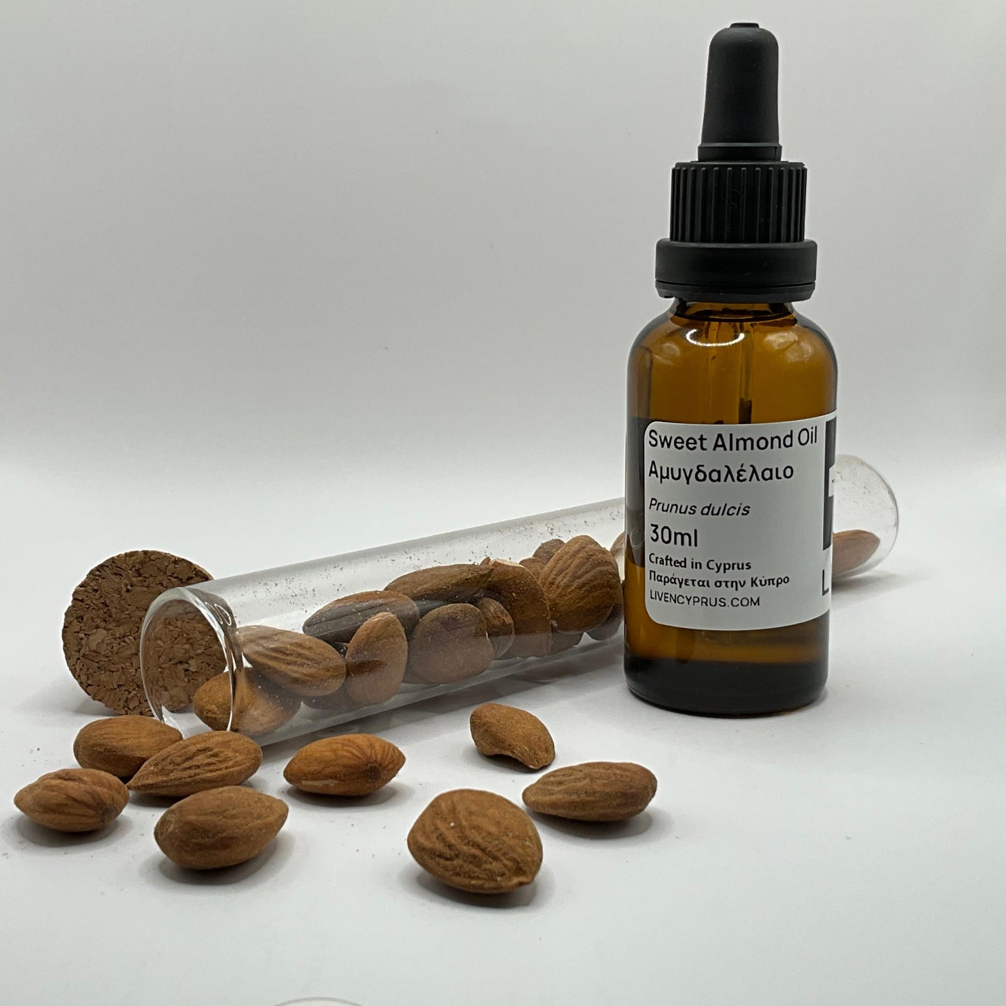Bottle of sweet almond oil with almonds from cyprus mountains