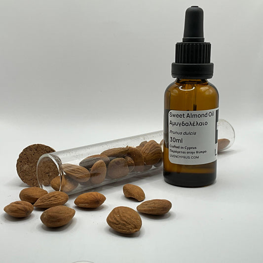 Bottle of sweet almond oil with almonds from cyprus mountains