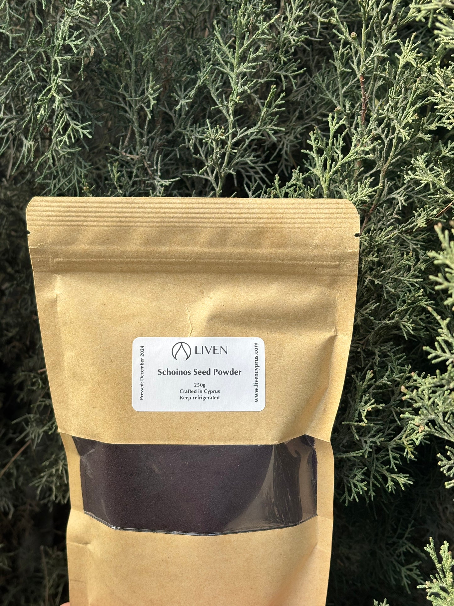 A packaged product labeled as 'Schinos Seed Powder' mastic berry.