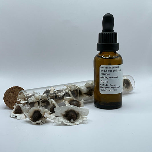 Bottle of Moringa Seed Oil with dried moringa seeds From cyprus