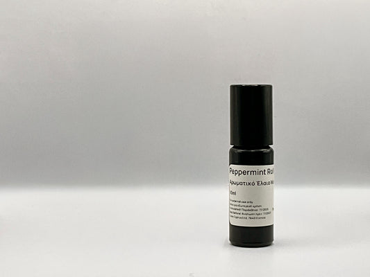 Peppermint roll-on bottle with black cap and white label on a gray background