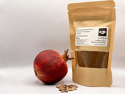 Pomegranate seed flour package with a pomegranate and seeds on a white background