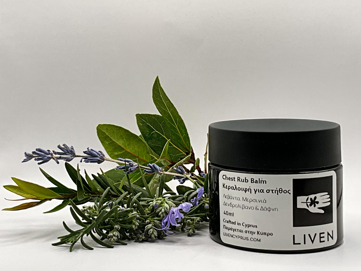 Jar of Liven chest rub balm with lavender and eucalyptus leaves