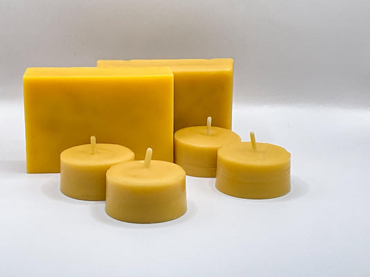 Set of beeswax candles in various shapes on a white background
