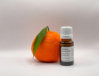 Mandarin essential oil bottle with a cyprus mandarin fruit 