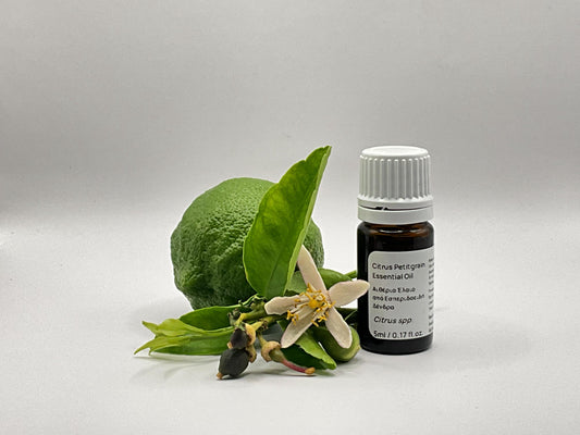 Bottle of petitgrain essential oil with  lemon flower