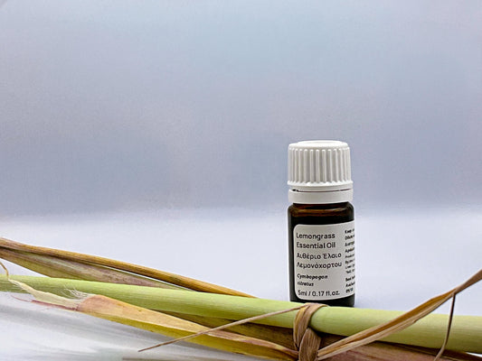 cyprus lemongrass essentail oil and plants herb next to it